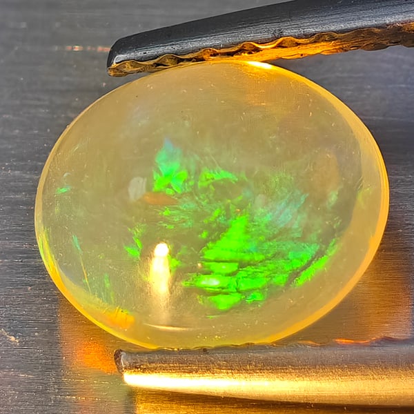 Natural Multi-Color Play Of Colour Opal 0.92 Ct. Oval Cabochon Shape 7.8 x 6.4 Mm Gemstone From (1 of 3)