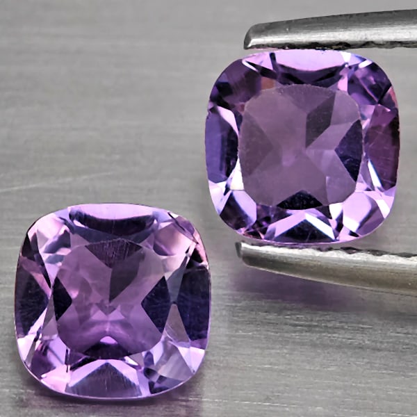 Natural Purple Amethyst 1.64 Ct. 2 Pcs Cushion Shape 6.3 Mm Gemstone From Brazil: Product ID: 800325555 Product Name: Natural Amethyst Weight: 1.64 CT. Size: 6.3 x 6.3 x 3.7 MM. Shape: Cushion Shape Color: Purple Clarity:VSI Luster: Good Gems Origin: Brazil Treatment: Unheated Crys