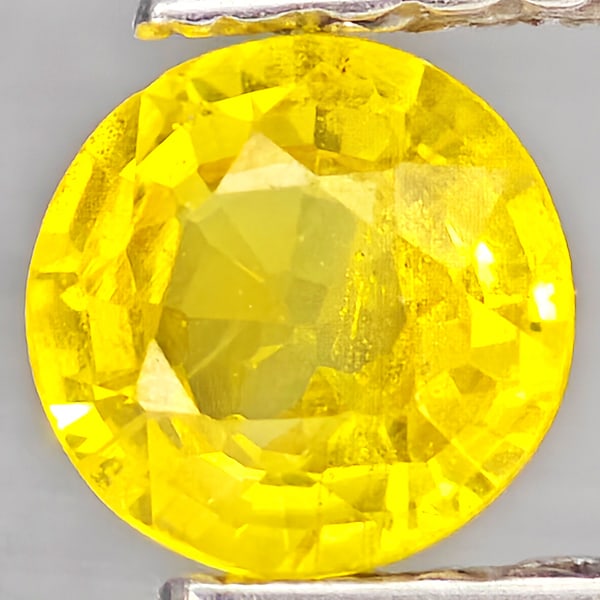 Natural Yellow Sapphire 0.47 Ct. Round Shape 4.8 Mm Gemstones From Thailand: Product ID: 806162937 Product Name: Natural Yellow Sapphire Weight: 0.47 CT. Size: 4.8 x 4.8 x 2.5 MM. Shape: Round Shape Color: Yellow Clarity:VSI Luster: Good Gems Origin: Thailand Treatment: Heated
