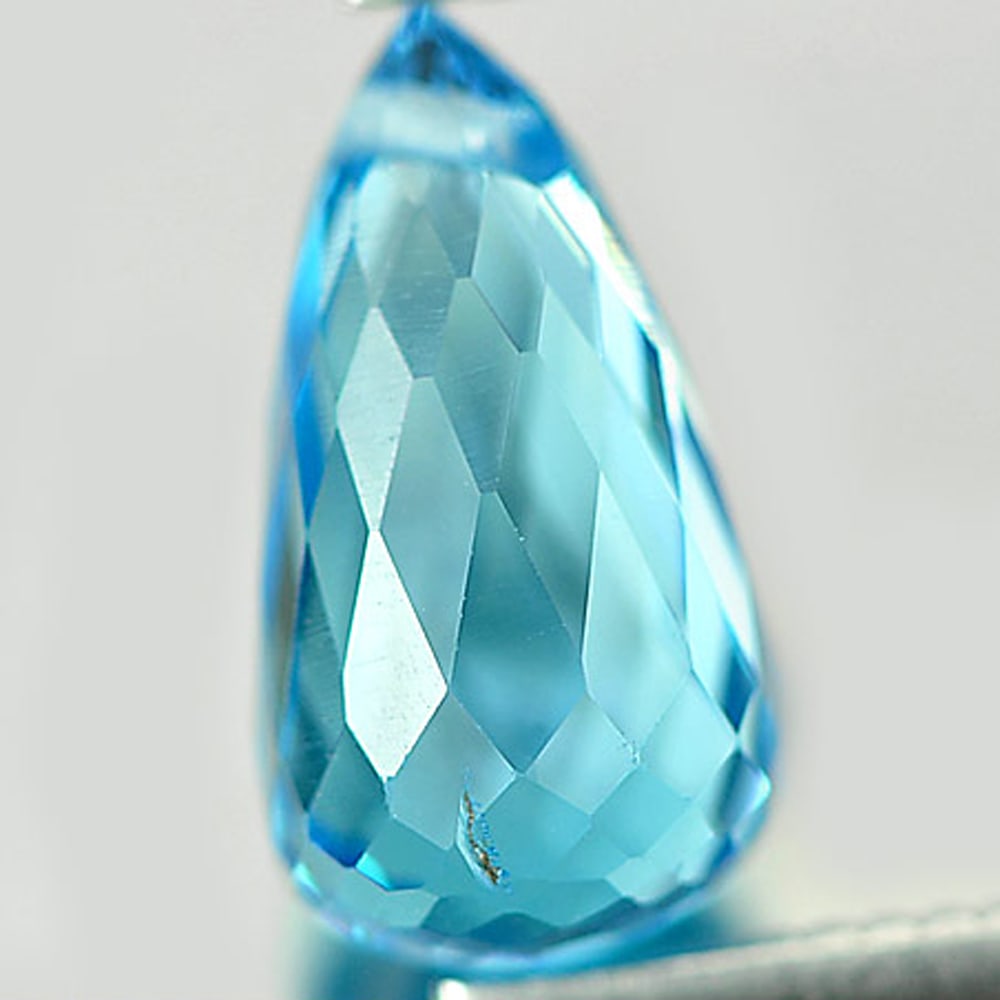 Natural Swiss Blue Topaz 2.34 Ct. Briolette with Drilled Shape 10 x 5.5 Mm Gemstone From Brazil: Product ID: 807164592 Product Name: Natural Blue Topaz Weight: 2.34 CT. Size: 10 x 5.5 x 5.5 MM. Shape: Briolette with Drilled Color: Swiss Blue Clarity:VSI Luster: Good Gems Origin: Brazil Treatment: