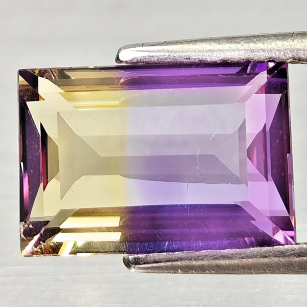 Natural Bi Color Ametrine 2.60 Ct. Baguette Shape 10.2 x 7.1 Mm Gemstone From Bolivia: Product ID: 800408214 Product Name: Natural Ametrine Weight: 2.60 CT. Size: 10.2 x 7.1 x 4.4 MM. Shape: Baguette Color: Bi Color Clarity:VSI Luster: Very Good Gems Origin: Bolivia Treatment: Unheated