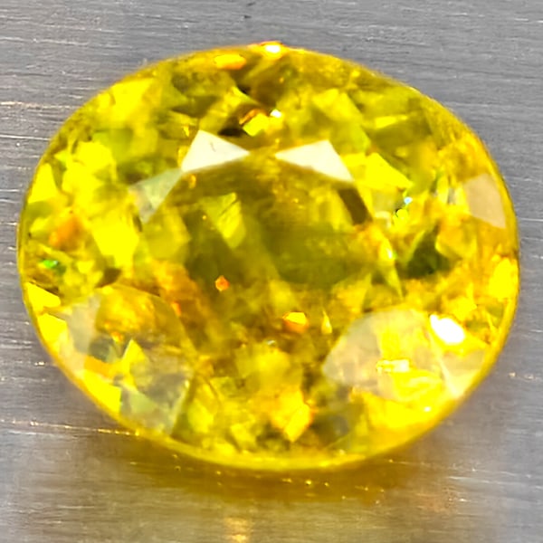 Natural Multi Color Titanium Rainbow Spark Sphene 1.69 Ct. Oval Shape 7.5 x 6.4 Mm Gemstone From: Product ID: 806509067 Product Name: Natural Sphene Weight: 1.69 CT. Size: 7.5 x 6.4 x 4.6 MM. Shape: Oval Color: Multi-Color Clarity:SI1 Luster: Good Gems Origin: Madagascar Treatment: Unheated Crysta