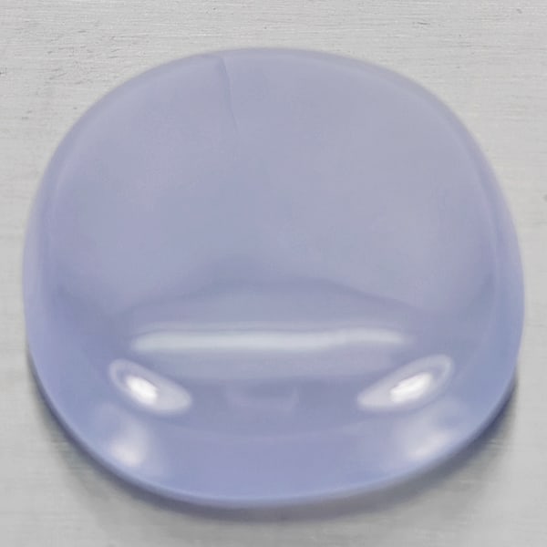 Natural Lavender Chalcedony 25.50 Ct. Oval Cabochon Shape 21 x 19 Mm Gemstone From Russia: Product ID: 801502669 Product Name: Natural Chalcedony Weight: 25.50 CT. Size: 21 x 19 x 8 MM. Shape: Oval Cabochon Color: Lavender Clarity:Semi - Transparent Luster: Good Gems Origin: Russia Treatmen