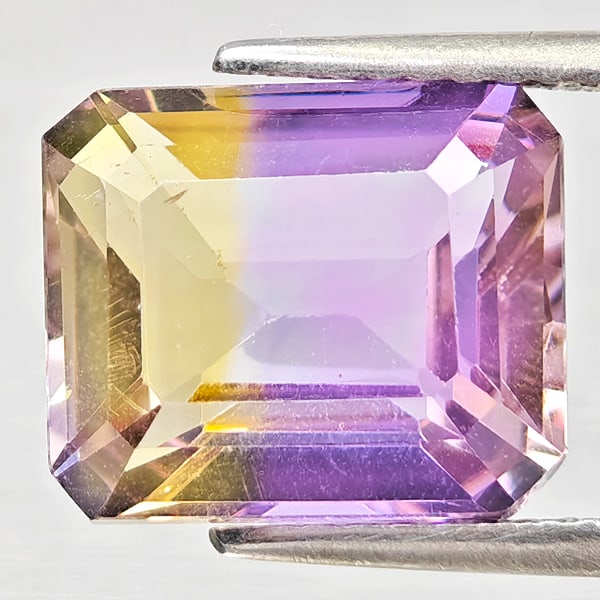 Natural Bi Color Ametrine 4.37 Ct. Octagon Shape 10.9 x 9.2 Mm Gemstone From Bolivia: Product ID: 800408427 Product Name: Natural Ametrine Weight: 4.37 CT. Size: 10.9 x 9.2 x 6 MM. Shape: Octagon Color: Bi Color Clarity:VSI Luster: Good Gems Origin: Bolivia Treatment: Unheated Crystal