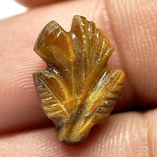 Natural Golden Tiger Eye 5.86 Ct. Leaves Carving 15.8 x 11.5 Mm. Gemstone Unheated: Product ID: 811600018 / Product Name: Natural Tiger eye / Weight: 5.86 CT. / Size: 15.8 x 11.5 x 5.2 MM. / Shape: Carving Leaves / Color: Golden / Clarity:Opaque / Luster: Good / Gems Origin: Thailand