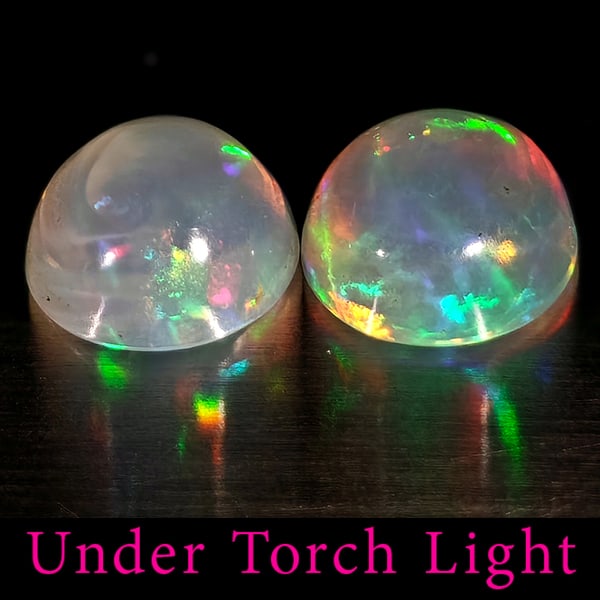 Natural Multi Color Opal 1.74 Ct. 2 Pcs Round Cabochon Shape 7 Mm Gemstones from Ethiopia: Product ID: 818728201 Product Name: Natural Opal Weight: 1.74 CT. Size: 7 x 7 x 4 MM. Shape: Round Color: Multi-Color Clarity:Semi - Transparent Luster: Good Gems Origin: Ethiopia Treatment: Unheated