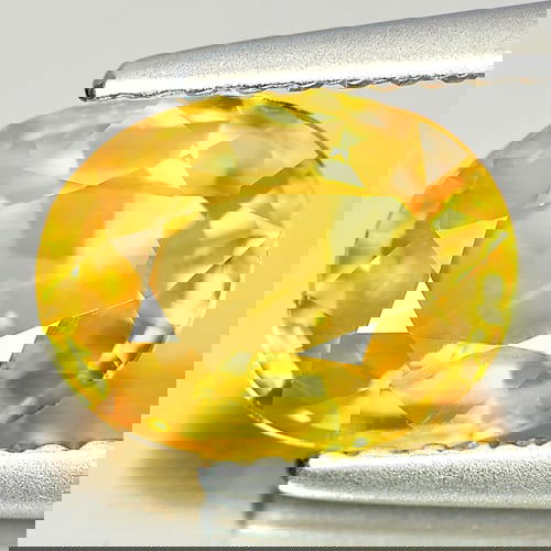 Natural Yellow Sapphire 1.85 Ct. Oval Shape 8.4 x 6.4 Mm Gemstone From Thailand: Product ID: 806151546 Product Name: Natural Yellow Sapphire Weight: 1.85 CT. Size: 8.4 x 6.4 x 3.8 MM. Shape: Oval Color: Yellow Clarity:VSI Luster: Very Good Gems Origin: Thailand Treatment: Heated C