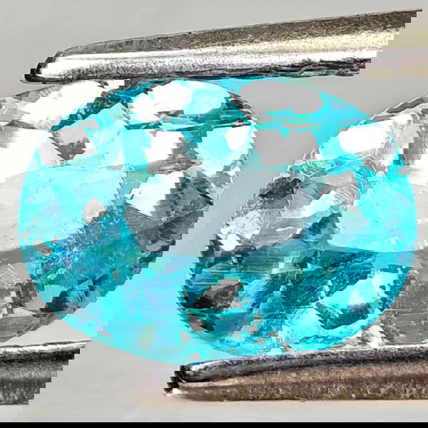 Natural Paraiba Color Apatite 0.83 Ct. Oval Shape 7.1 x 5.1 Mm Gemstones From Tanzania: Product ID: 800613689 Product Name: Natural Apatite Weight: 0.83 CT. Size: 7.1 x 5.1 x 3.3 MM. Shape: Oval Color: Neon Blue Clarity:VSI Luster: Good Gems Origin: Tanzania Treatment: Unheated Crystal S