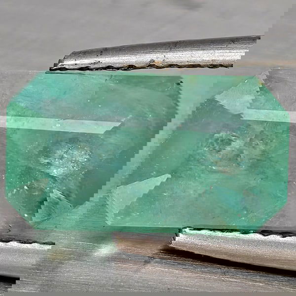 Natural Green Blueish Grandidierite 3.64 Ct. Octagon Shape 11.7 x 6.5 Mm Gemstone from Madagascar: Product ID: 803100051 Product Name: Natural Tsavorite Weight: 3.64 CT. Size: 11.7 x 6.5 x 5.1 MM. Shape: Octagon Color: Green Blueish Clarity:SI1 Luster: Good Gems Origin: Madagascar Treatment: Unheat