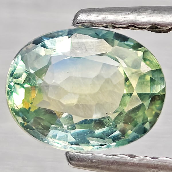 Natural Greenish Yellow Sapphire 0.86 Ct. Oval Shape 6.3 x 5 Mm Gemstone From Thailand (1 of 3)
