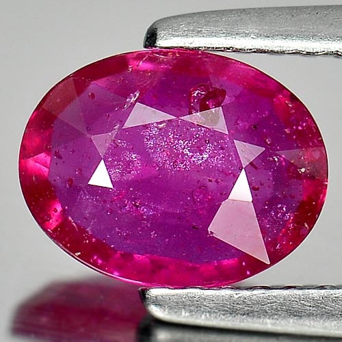 Natural Purplish Pink Ruby 1.40 Ct. Oval Shape 8 x 6.2 Mm. Gemstone From Mozambique: Product ID: 805926595 Product Name: Natural Ruby Weight: 1.40 CT. Size: 8 x 6.2 x 2.7 MM. Shape: Oval Color: Purplish Pink Clarity:VSI Luster: Good Gems Origin: Mozambique Treatment: Heated (Lead-glas