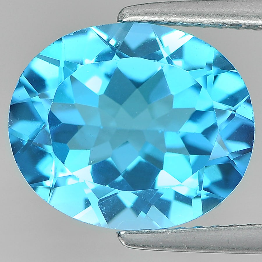 Natural Swiss Blue Topaz 4.84 Ct. VVS Oval Shape 12 x 10 Mm. Gemstone From Brazil: Product ID: 807161135 Product Name: Natural Blue Topaz Weight: 4.84 CT. Size: 12 x 10 x 5.7 MM. Shape: Oval Color: Swiss Blue Clarity:VVS Luster: Good Gems Origin: Brazil Treatment: Treated Crystal St