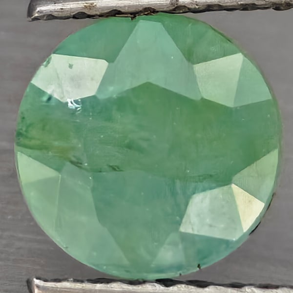 Natural Green Blueish Grandidierite 1.76 Ct. Round Shape 7 Mm Gemstone from Madagascar: Product ID: 803100118 Product Name: Natural Tsavorite Weight: 1.76 CT. Size: 7 x 7 x 5 MM. Shape: Round Shape Color: Green Blueish Clarity:SI1 Luster: Good Gems Origin: Madagascar Treatment: Unheated
