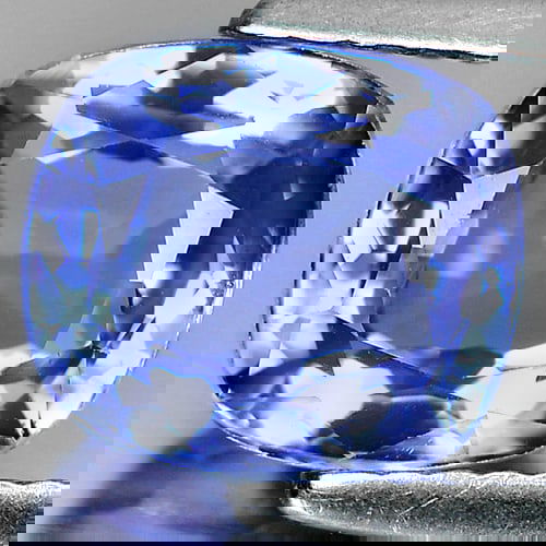 Natural Violetish Blue Tanzanite 2.71 Ct. Clean Cushion Shape 8.37 x 7.35 Mm Gemstone from Tanzania: Product ID: 107000414 Product Name: Natural Tanzanite Weight: 2.71 CT. Size: 8.37 x 7.35 x 5.07 MM. Shape: Cushion Color: Violetish Blue Clarity:IF Luster: Very Good Gems Origin: Tanzania Treatment: H