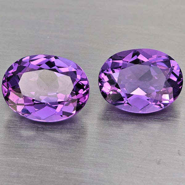Natural Purple Amethyst 5.01 Ct. 2 Pcs. VVS Oval Shape 10 x 8.9 Mm. Gemstone From Brazil: Product ID: 800325605 Product Name: Natural Amethyst Weight: 5.01 CT. Size: 10 x 8.9 x 5.5 MM. Shape: Oval Color: Purple Clarity:VVS Luster: Good Gems Origin: Brazil Treatment: Unheated Crystal Struct