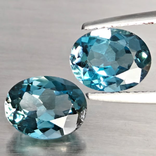Natural London Blue Topaz 4.33 Ct. 2 Pcs Oval Shape 9 x 7.1 Mm Gemstone from Brazil: Product ID: 807168961 Product Name: Natural Blue Topaz Weight: 4.33 CT. Size: 9 x 7.1 x 4.6 MM. Shape: Oval Color: London Blue Clarity:SI1 Luster: Good Gems Origin: Brazil Treatment: Treated Crystal S
