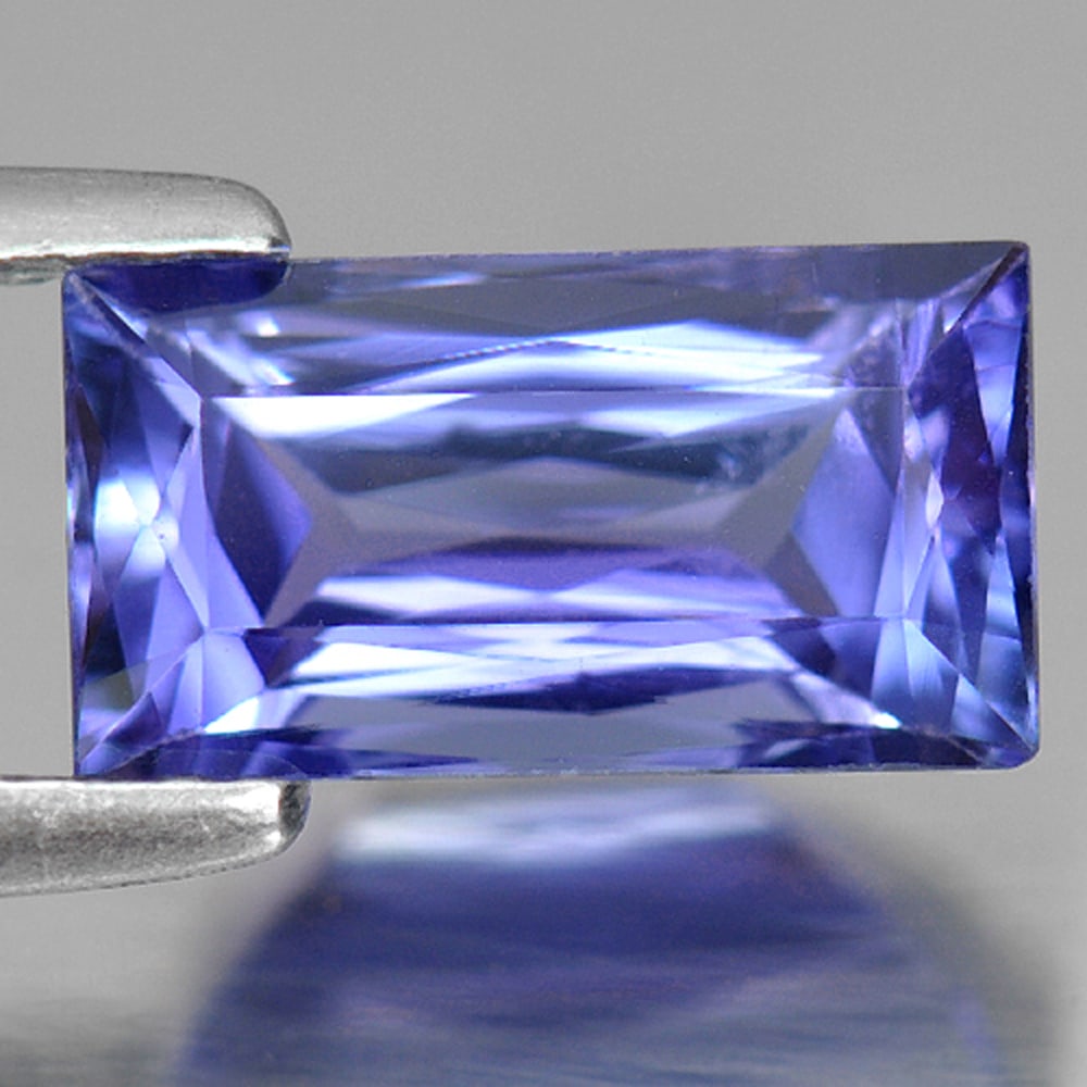 Natural Violetish Blue Tanzanite 2.14 Ct Clean Baguette Shape 10 x 5.4 Mm. Gemstone From Tanzania: Product ID: 807006459 Product Name: Natural Tanzanite Weight: 2.14 CT. Size: 10 x 5.4 x 4.3 MM. Shape: Baguette Color: Violetish Blue Clarity:IF Luster: Good Gems Origin: Tanzania Treatment: Heated Cr