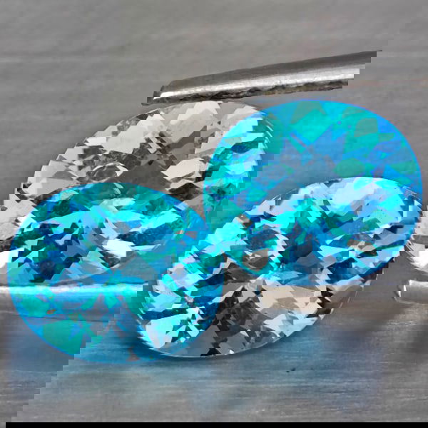 Natural Swiss Blue Topaz 2.61 Ct. 2 Pcs. VVS Oval Shape 7.4 x 6.3 Mm. Gemstone from Brazil: Product ID: 807169060 Product Name: Natural Blue Topaz Weight: 2.61 CT. Size: 7.4 x 6.3 x 4.3 MM. Shape: Oval Shape Color: Swiss Blue Clarity:VVS Luster: Good Gems Origin: Brazil Treatment: Treated Cr
