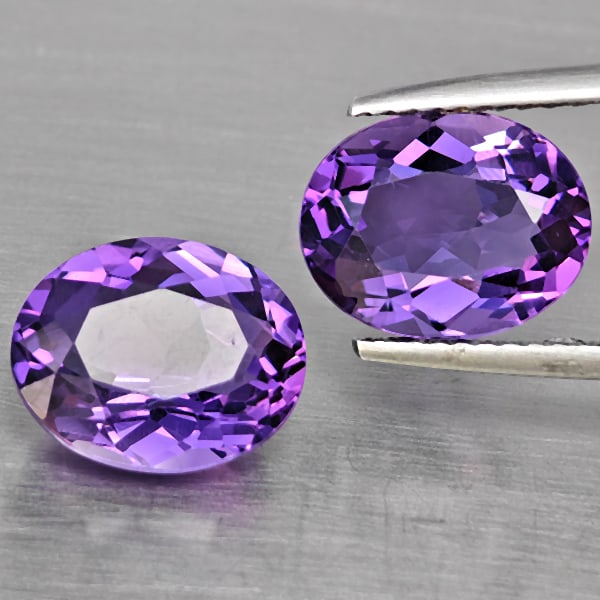 Natural Purple Amethyst 5.43 Ct. 2 Pcs. VVS Oval Shape 10.4 x 8.3 Mm Gemstone From Brazil: Product ID: 800325608 Product Name: Natural Amethyst Weight: 5.43 CT. Size: 10.4 x 8.3 x 5.5 MM. Shape: Oval Color: Purple Clarity:VVS Luster: Very Good Gems Origin: Brazil Treatment: Unheated Crystal