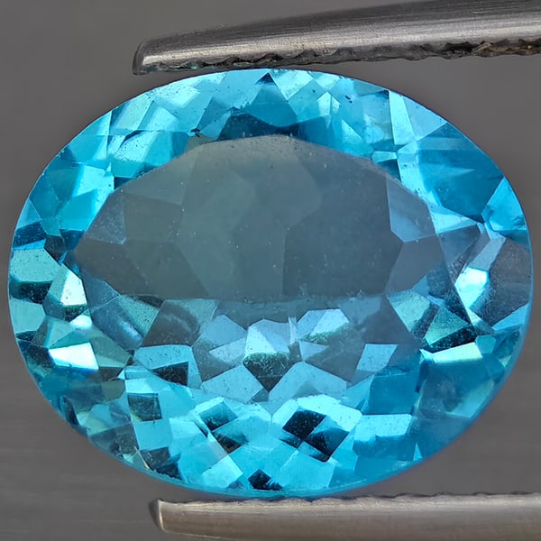 Natural Gem Swiss Blue Topaz 4.57 Ct. Oval Shape 12 x 10 Mm Gemstone from Brazil: Product ID: 807169028 Product Name: Natural Blue Topaz Weight: 4.57 CT. Size: 12 x 10 x 5.3 MM. Shape: Oval Shape Color: Swiss Blue Clarity:VSI Luster: Good Gems Origin: Brazil Treatment: Treated Crys