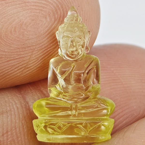 Natural Yellow Quartz Buddha Carving 4.20 Ct. Size 16.8 x 10 Mm. Gemstone from Brazil: Product ID: 805530220 Product Name: Natural Quartz Weight: 4.20 CT. Size: 16.8 x 10 x 5.5 MM. Shape: Carving Color: Yellow Clarity:VSI Luster: Good Gems Origin: Burma Treatment: Unheated Crystal Struc