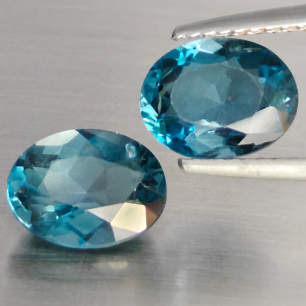 Natural London Blue Topaz 4.01 Ct. 2 Pcs Oval Shape 9 x 7 Mm Gemstone from Brazil: Product ID: 807168962 Product Name: Natural Blue Topaz Weight: 4.01 CT. Size: 9 x 7 x 4.3 MM. Shape: Oval Color: London Blue Clarity:SI1 Luster: Good Gems Origin: Brazil Treatment: Treated Crystal Str