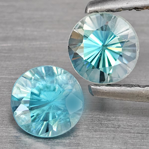 Natural Blue Zircon 1.23 Ct. 2 Pcs Round Diamond Cut 4.8 Mm Gemstone From Cambodia: Product ID: 807743232 Product Name: Natural Zircon Weight: 1.23 CT. Size: 4.8 x 4.8 x 3.5 MM. Shape: Round Diamond Cut Color: Blue Clarity:SI1 Luster: Good Gems Origin: Cambodia Treatment: Heated Crys