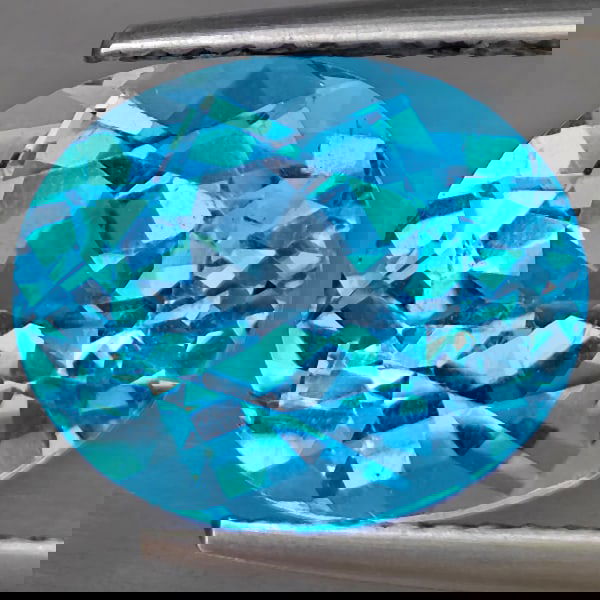 Natural Swiss Blue Topaz 6.17 Ct. Oval Shape 12.1 x 10.1 Mm Gemstone from Brazil: Product ID: 807169029 Product Name: Natural Blue Topaz Weight: 6.17 CT. Size: 12.1 x 10.1 x 7 MM. Shape: Oval Shape Color: Swiss Blue Clarity:VSI Luster: Good Gems Origin: Brazil Treatment: Treated Cr