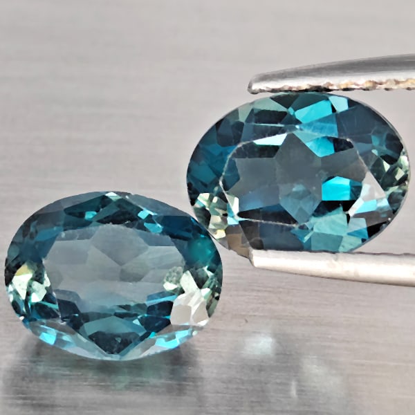 Natural London Blue Topaz 4.72 Ct. 2 Pcs Oval Shape 9 x 7.3 Mm Gemstone from Brazil: Product ID: 807168902 Product Name: Natural Blue Topaz Weight: 4.72 CT. Size: 9 x 7.3 x 4.3 MM. Shape: Oval Color: London Blue Clarity:SI1 Luster: Good Gems Origin: Brazil Treatment: Treated Crystal S
