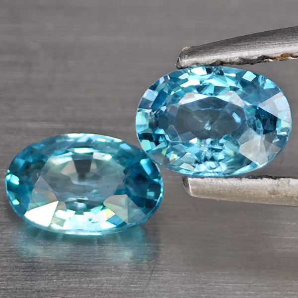 Natural Blue Zircon 1.40 Ct. 2 Pcs Oval Shape 6.1 x 4.4 Mm Gemstone from Cambodia: Product ID: 807725462 Product Name: Natural Zircon Weight: 1.40 CT. Size: 6.1 x 4.4 x 2.7 MM. Shape: Oval Shape Color: Blue Clarity:SI1 Luster: Good Gems Origin: Cambodia Treatment: Heated Crystal Str