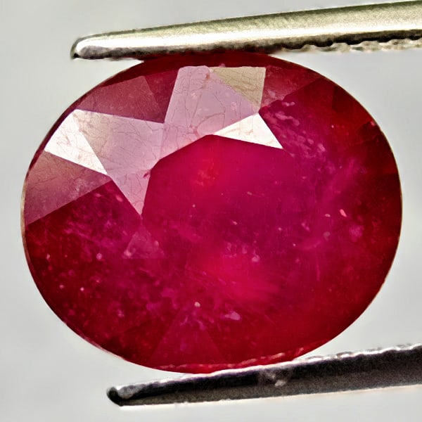 Natural Red Ruby 5.39 Ct. Oval Shape 10.7 x 9 Mm. Gemstone From Madagascar: Product ID: 805935059 Product Name: Natural Ruby Weight: 5.39 CT. Size: 10.7 x 9 x 6.2 MM. Shape: Oval Color: Red Clarity:VSI Luster: Good Gems Origin: Madagascar Treatment: Heated Lead-glass filling