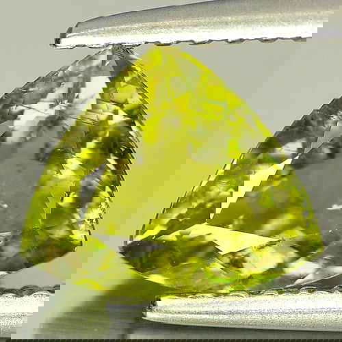 Natural Green Yellow Tourmaline 1.07 Ct. Trilliant Shape 7.1 x 6.7 Mm. Unheated Gemstone From: Product ID: 807218095 Product Name: Natural Tourmaline Weight: 1.07 CT. Size: 7.1 x 6.7 x 3.8 MM. Shape: Trilliant Color: Green Yellow Clarity:SI Luster: Good Gems Origin: Nigeria Treatment: Unheated