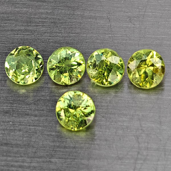 Natural Green Demantiod Garnet 0.77 Ct. 5 Pcs Round Diamond Cut 3.3 Mm Gemstones From Madagascar: Product ID: 802937690 Product Name: Natural Demantoid Weight: 0.77 CT. Size: 3.3 x 3.3 x 2.5 MM. Shape: Round Diamond Cut Color: Green Clarity:SI1 Luster: Good Gems Origin: Madagascar Treatment: Unhea