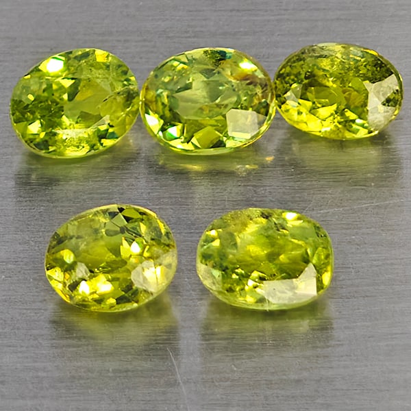 Natural Green Demantiod Garnet 1.28 Ct. 5 Pcs Oval Shape 4.1 x 3.3 Mm Gemstones From Madagascar: Product ID: 802937612 Product Name: Natural Demantoid Weight: 1.28 CT. Size: 4.1 x 3.3 x 2 MM. Shape: Oval Shape Color: Green Clarity:SI1 Luster: Good Gems Origin: Madagascar Treatment: Unheated Cryst