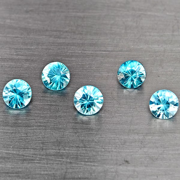Natural Blue Zircon 1.85 Ct. 5 Pcs Round Diamond Cut 4.1 Mm Gemstone from Cambodia: Product ID: 807743258 Product Name: Natural Gemstones Weight: 1.85 CT. Size: 4.1 x 4.1 x 3 MM. Shape: Round Diamond Cut Color: Blue Clarity:SI1 Luster: Good Gems Origin: Cambodia Treatment: Heated Cry