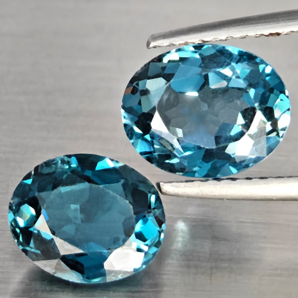 Natural London Blue Topaz 5.32 Ct. 2 Pcs Oval Shape 10 x 8 Mm Gemstone from Brazil: Product ID: 807168909 Product Name: Natural Blue Topaz Weight: 5.32 CT. Size: 10 x 8 x 5.1 MM. Shape: Oval Color: London Blue Clarity:SI1 Luster: Good Gems Origin: Brazil Treatment: Treated Crystal St