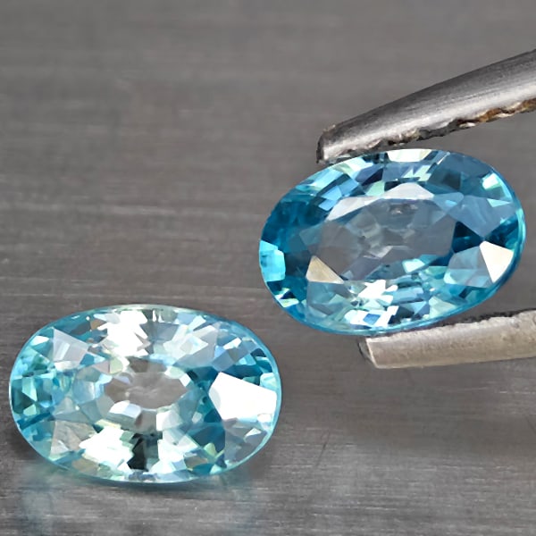 Natural Blue Zircon 1.54 Ct. 2 Pcs Oval Shape 6.2 x 4.1 Mm Gemstone from Cambodia: Product ID: 807725464 Product Name: Natural Zircon Weight: 1.54 CT. Size: 6.2 x 4.1 x 3.3 MM. Shape: Oval Shape Color: Blue Clarity:SI1 Luster: Good Gems Origin: Cambodia Treatment: Heated Crystal Str