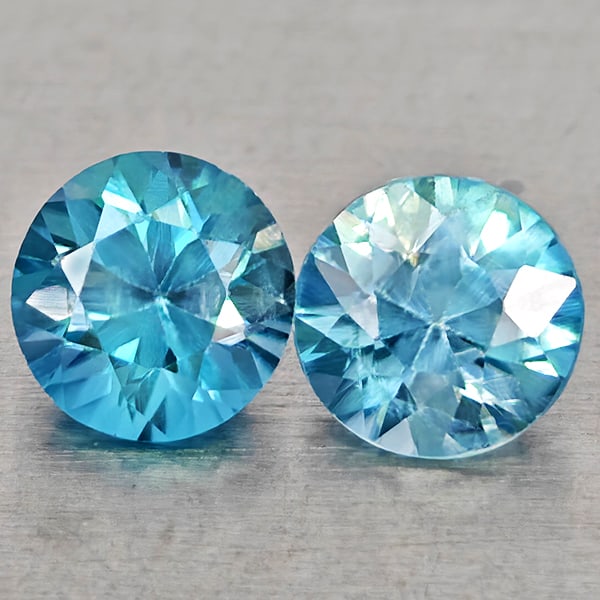 Natural Blue Zircon 1.21 Ct. 2 Pcs Round Diamond Cut 4.9 Mm Gemstones From Cambodia: Product ID: 807743032 Product Name: Natural Zircon Weight: 1.21 CT. Size: 4.9 x 4.9 x 3.4 MM. Shape: Round Diamond Cut Color: Blue Clarity:VSI Luster: Good Gems Origin: Cambodia Treatment: Heated Crys