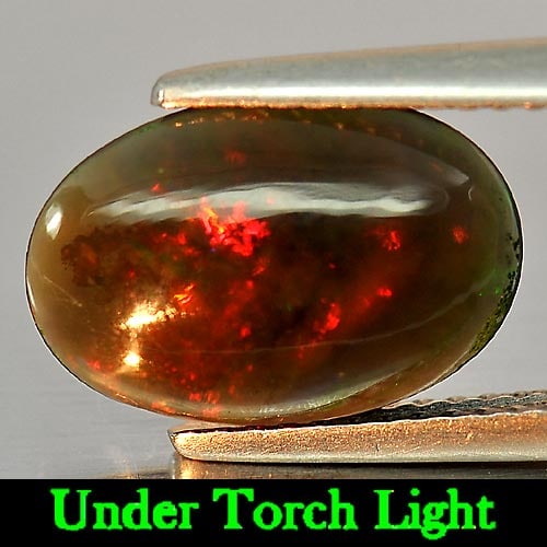 Natural Fire Red Black Opal 1.30 Ct. Oval Cabochon Shape 12.8 x 8.7 Mm. Unheated Gemstone: Product ID: 818724438 Product Name: Natural Opal Weight: 1.30 CT. Size: 12.8 x 8.7 x 2.9 MM. Shape: Oval Cabochon Color: Rainbow Fire Red Black Clarity:Semi - Transparent Luster: Iridescent Gems Origi