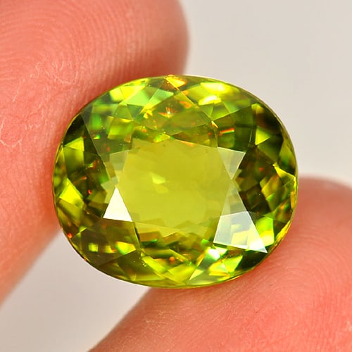 Natural Multi Color Sphene 8.86 Ct. VVS Oval Shape 15.2 x 13.1 Mm. Unheated Gemstone (1 of 3)