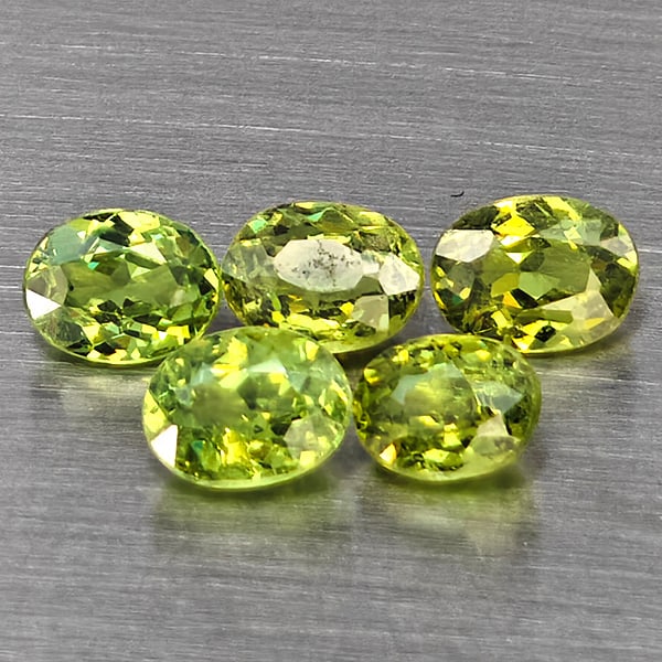 Natural Green Demantiod Garnet 1.45 Ct. 5 Pcs Oval Shape 4.5 x 3.5 Mm Gemstones From Madagascar: Product ID: 802937517 Product Name: Natural Demantoid Weight: 1.45 CT. Size: 4.5 x 3.5 x 2.5 MM. Shape: Oval Color: Green Clarity:SI1 Luster: Good Gems Origin: Madagascar Treatment: Unheated Crystal S