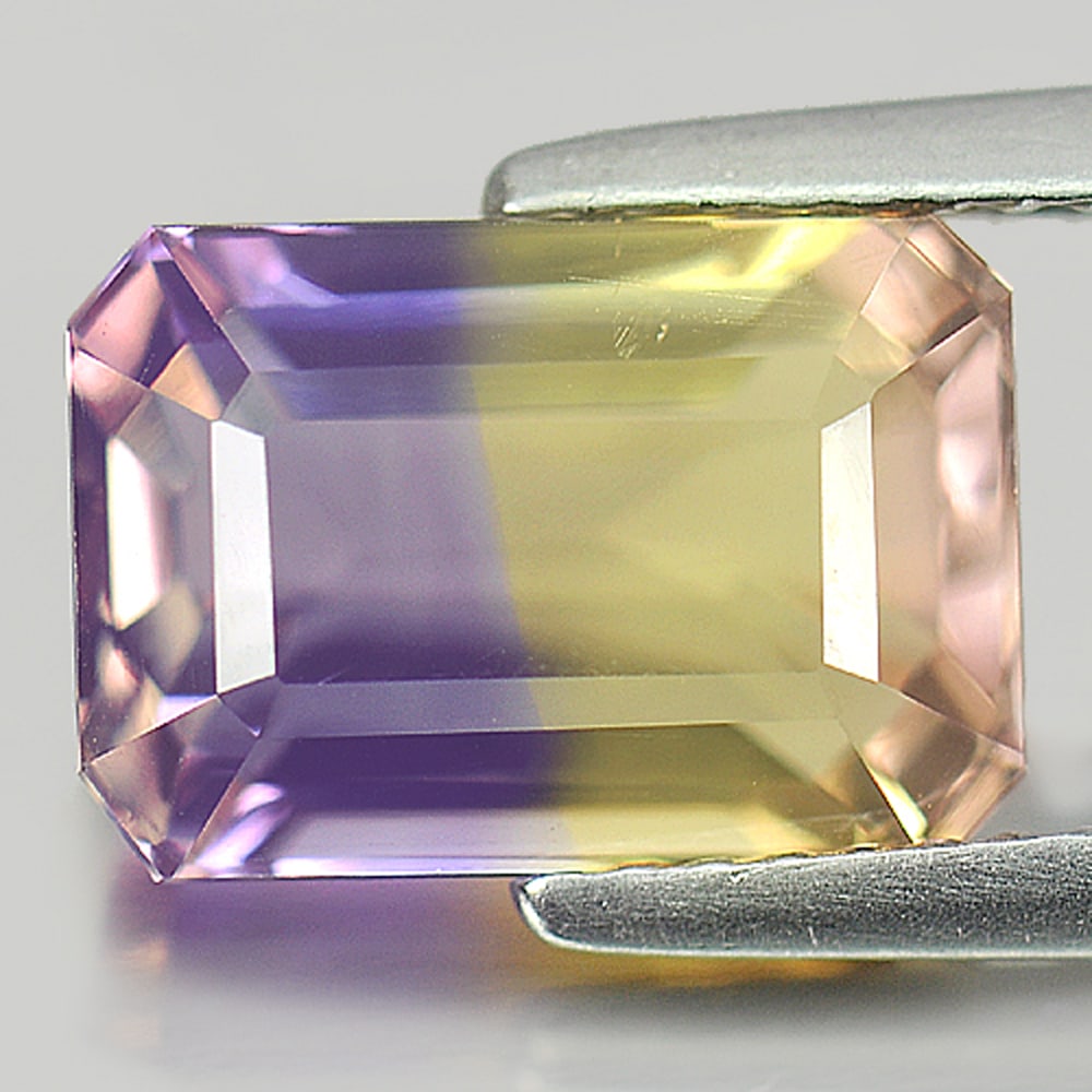 Natural Bi Color Ametrine 3.73 Ct. VVS Octagon Shape 11 x 7.7 Mm. Unheated Gemstone From Bolivia: Product ID: 800405153 Product Name: Natural Ametrine Weight: 3.73 CT. Size: 11 x 7.7 x 6.2 MM. Shape: Octagon Color: Bi Color Clarity:VVS Luster: Good Gems Origin: Bolivia Treatment: Unheated Crystal