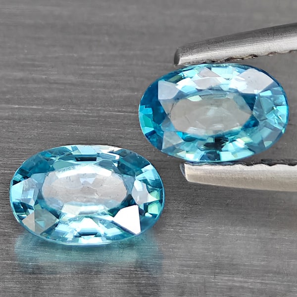Natural Blue Zircon 1.46 Ct. 2 Pcs Oval Shape 6.4 x 4.2 Mm Gemstone From Cambodia: Product ID: 807725460 Product Name: Natural Zircon Weight: 1.46 CT. Size: 6.4 x 4.2 x 2.9 MM. Shape: Oval Shape Color: Blue Clarity:SI1 Luster: Good Gems Origin: Cambodia Treatment: Heated Crystal Str
