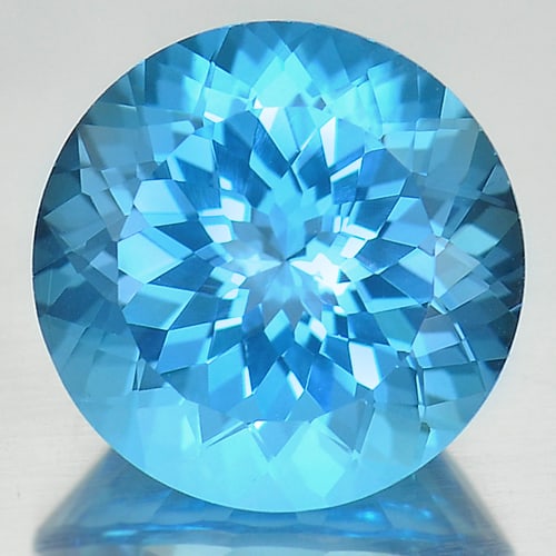 Natural Swiss Blue Topaz 14.86 Ct. Round Cornflower Cut 15.2 Mm Gemstone from Brazil: Product ID: 807166776 Product Name: Natural Blue Topaz Weight: 14.86 CT. Size: 15.2 x 15.2 x 10 MM. Shape: Round Color: Blue Clarity:IF Luster: Good Gems Origin: Brazil Treatment: Treated Crystal Stru