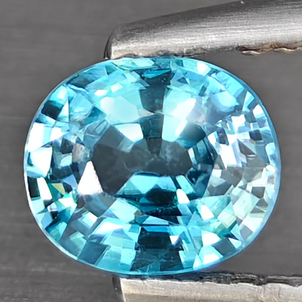 Natural Blue Zircon 0.98 Ct. Oval Shape 6.3 x 5.3 Mm Gemstone From Cambodia: Product ID: 807725455 Product Name: Natural Zircon Weight: 0.98 CT. Size: 6.3 x 5.3 x 3.3 MM. Shape: Oval Shape Color: Blue Clarity:SI1 Luster: Good Gems Origin: Cambodia Treatment: Heated Crystal Str