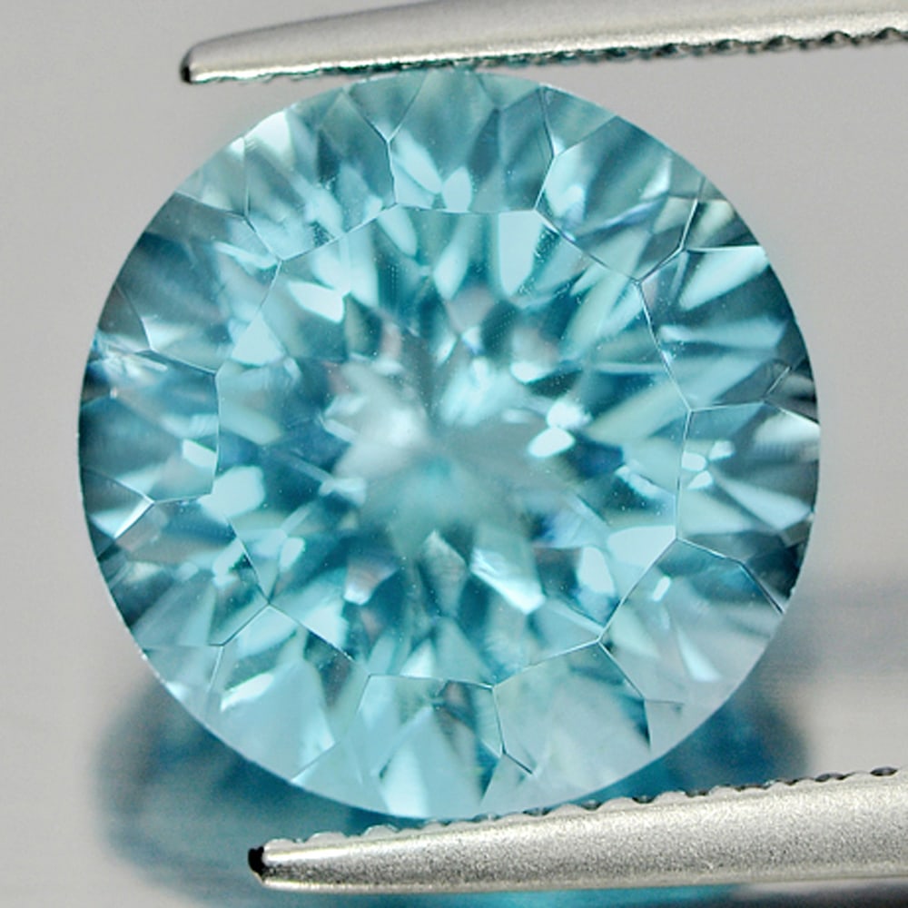 Natural Blue Topaz 7.86 Ct. Clean Round Cornflower Cut 11.8 Mm. Gemstone From Brazil: Product ID: 807165829 Product Name: Natural Blue Topaz Weight: 7.86 CT. Size: 11.8 x 11.8 x 7.7 MM. Shape: Round Cornflower Cut Color: Blue Clarity:IF Luster: Very Good Gems Origin: Brazil Treatment:
