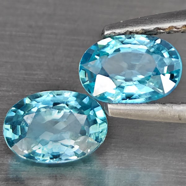 Natural Blue Zircon 1.56 Ct. 2 Pcs Oval Shape 6.2 x 4.2 Mm Gemstone From Cambodia: Product ID: 807725456 Product Name: Natural Zircon Weight: 1.56 CT. Size: 6.2 x 4.2 x 3.5 MM. Shape: Oval Shape Color: Blue Clarity:SI1 Luster: Good Gems Origin: Cambodia Treatment: Heated Crystal Str