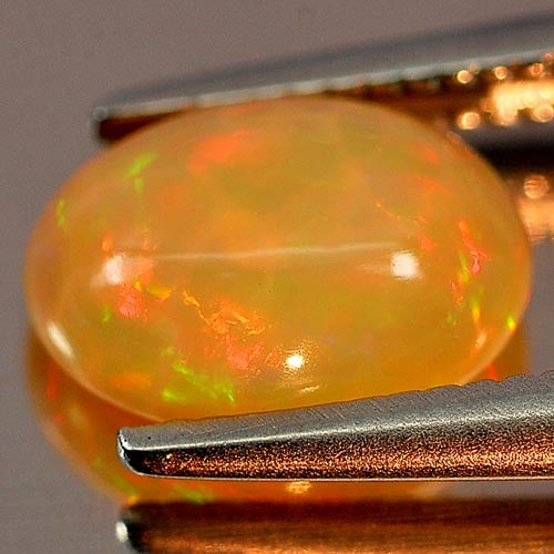Natural Multi Color Play Of Colour Opal 0.86 Ct. Oval Cabochon Shape 8.1 x 6 Mm Gemstone from (1 of 3)