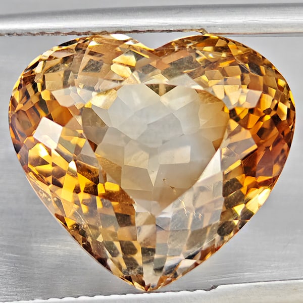 Natural Imperial Topaz 18.06 Ct. Heart Shape 14.5 x 12.2 Mm. Gemstone From Brazil: Product ID: 807168611 Product Name: Natural Topaz Weight: 18.06 CT. Size: 14.5 x 12.2 x 10.2 MM. Shape: Heart Shape Color: Imperial Clarity:VSI Luster: Very Good Gems Origin: Brazil Treatment: Treated
