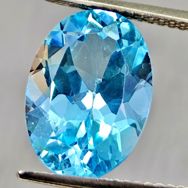 Natural Swiss Blue Topaz 6.23 Ct. Oval Shape 13.9 x 10 Mm Gemstone From Brazil (1 of 3)